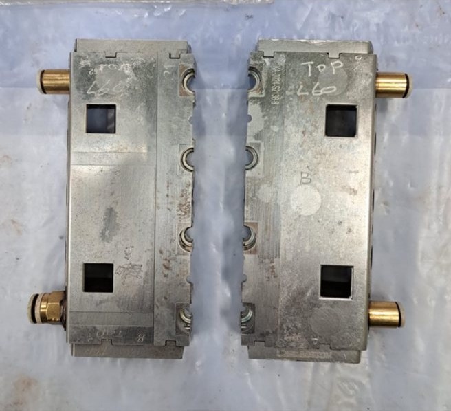 Two slider inserts from the mould