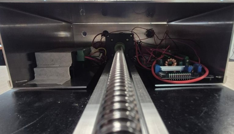 Electronics and ball screw inside the enclosure